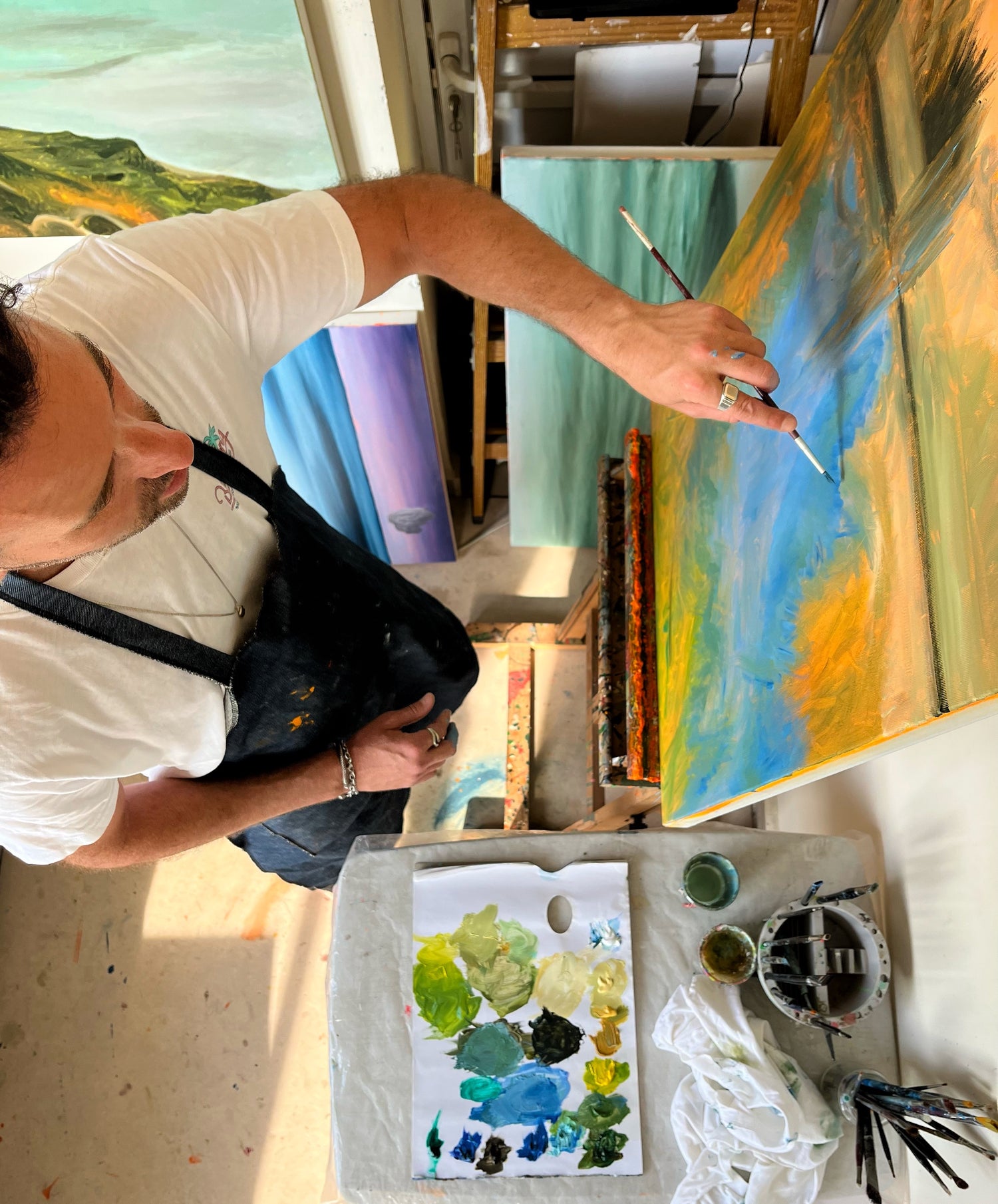 Ori Feinberg painting at his studio.